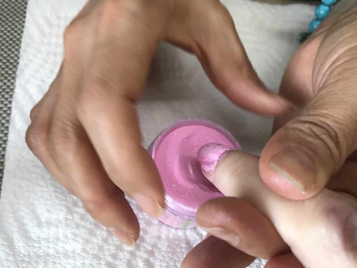 Applying the color for the perfect manicure