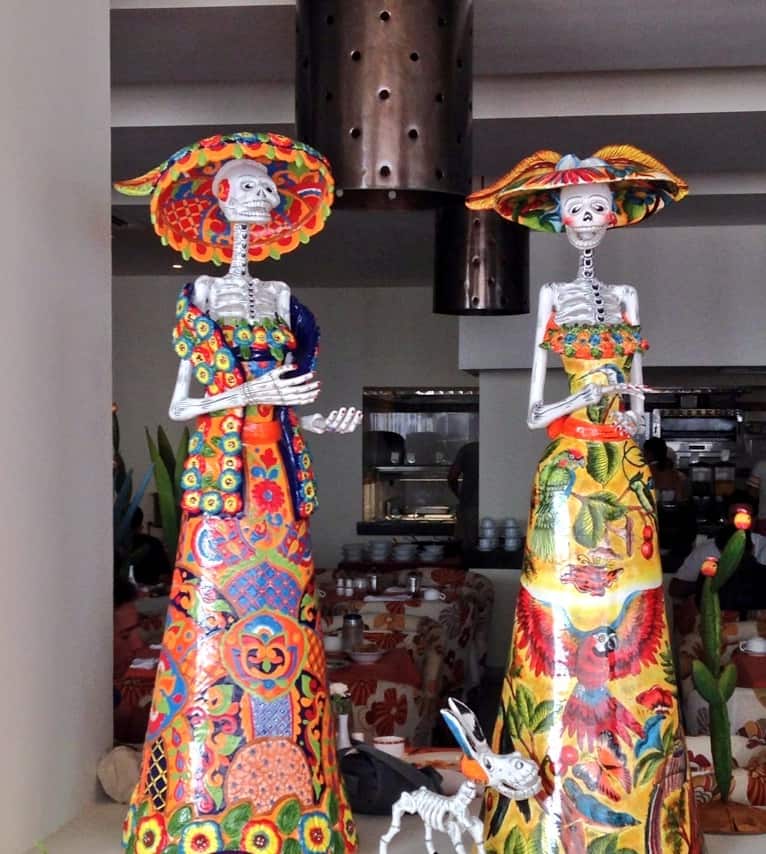 Day of the Dead figurines on display at Secrets Huatulco