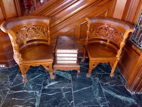 Intricately-carved chairs at the entrance lobby