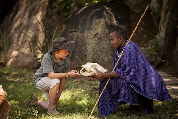 Young visitor with Masai tribesman (Credit: Four Seasons Hotels and Resorts)