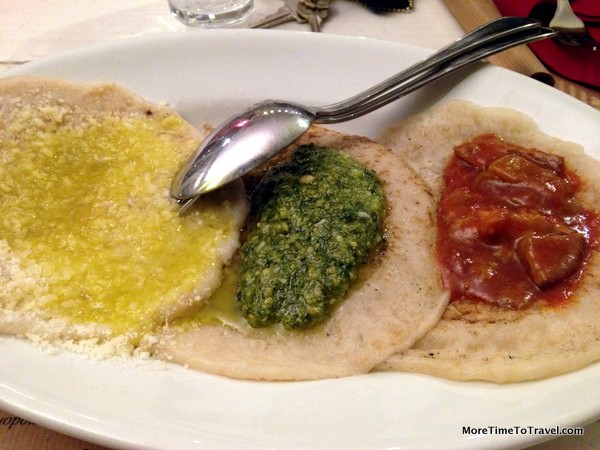 Panagacci with parmigiana cheese and olive oil, pesto and mushroom sauce