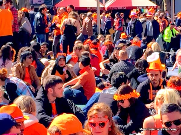 Revelers in the busy Rembrandtplein square in Amsterdam
