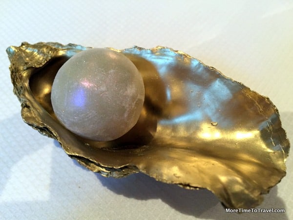 Edible pearl amuse bouche filled with tanqueray gin, lime and oyster juice
