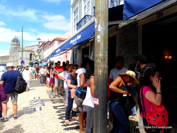 Line outside the bakery extending towards the monastery