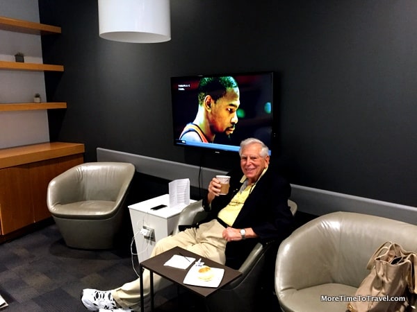 Relaxing in the glass-enclosed TV room at the Airspace Lounge at JFK 
