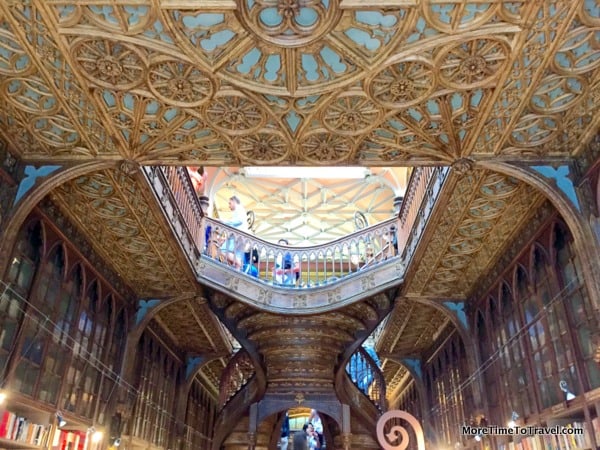Intricately painted ceiling at Livraria Lello