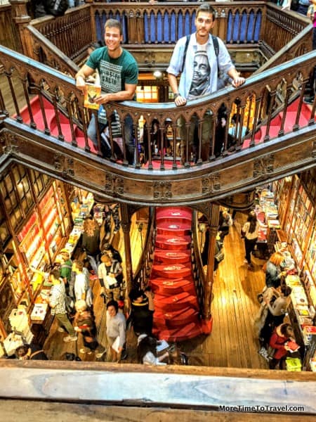 Visitors pose on the famous red staircase