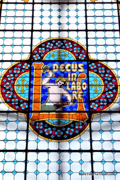 Stained glass skylight with the store's motto