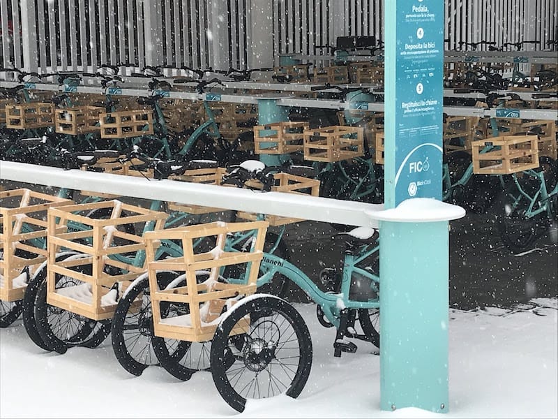 Tricycles in the snow outside of FICO Eataly World in Bolognak