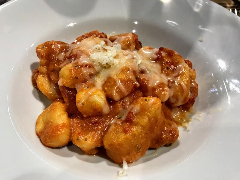 Gnocchi with tomato, basil, ricotta and red Bolognese sauce at Amerigo 1934 at FICO, one of our favorite food experiences