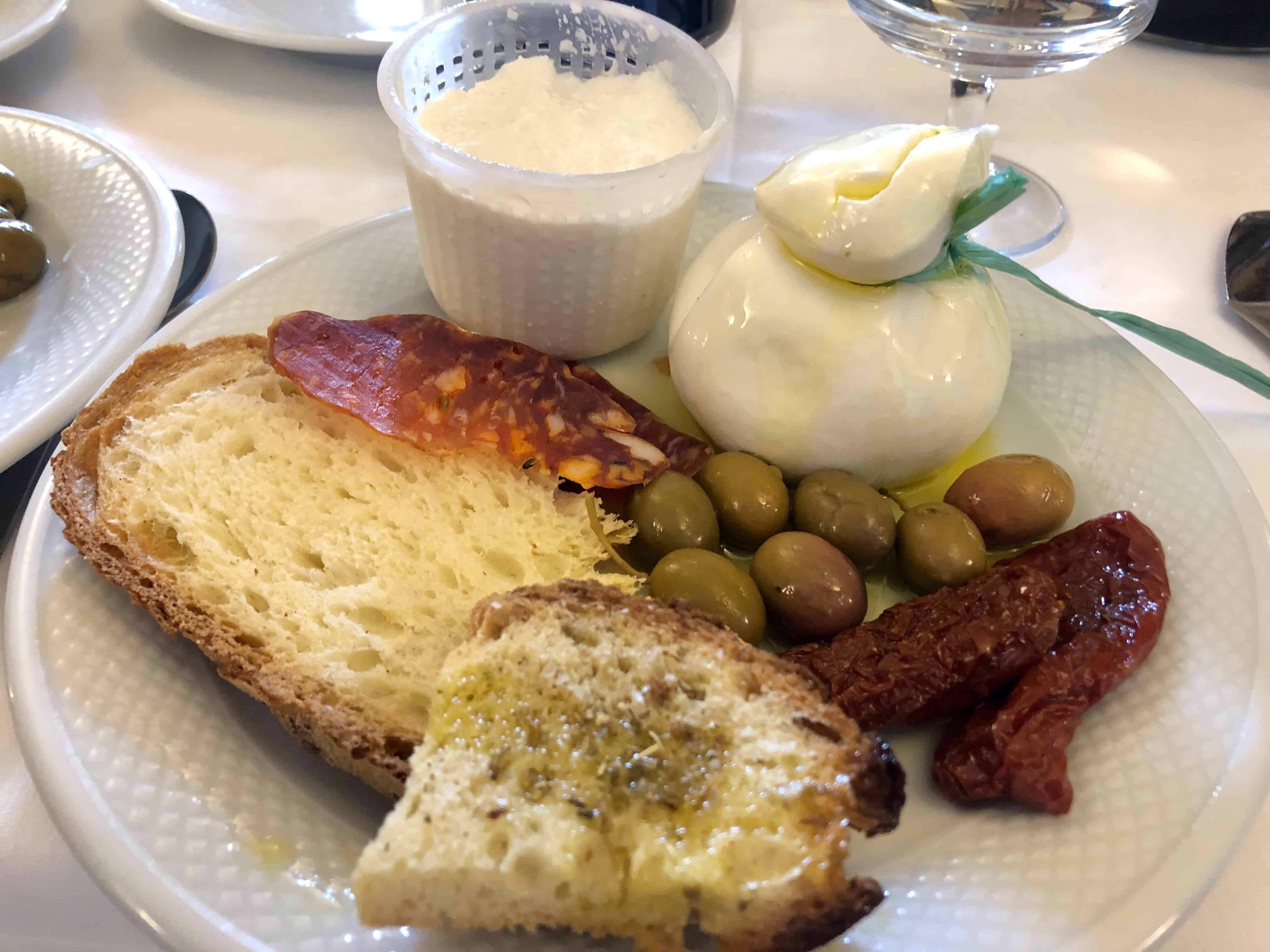 An antipasto starter at Il Terrazzino with homemade bread, cured meats and local cheeses