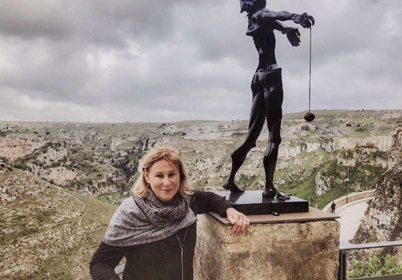 Author beside one of the 200 works by Salvatore Dali on display in Matera