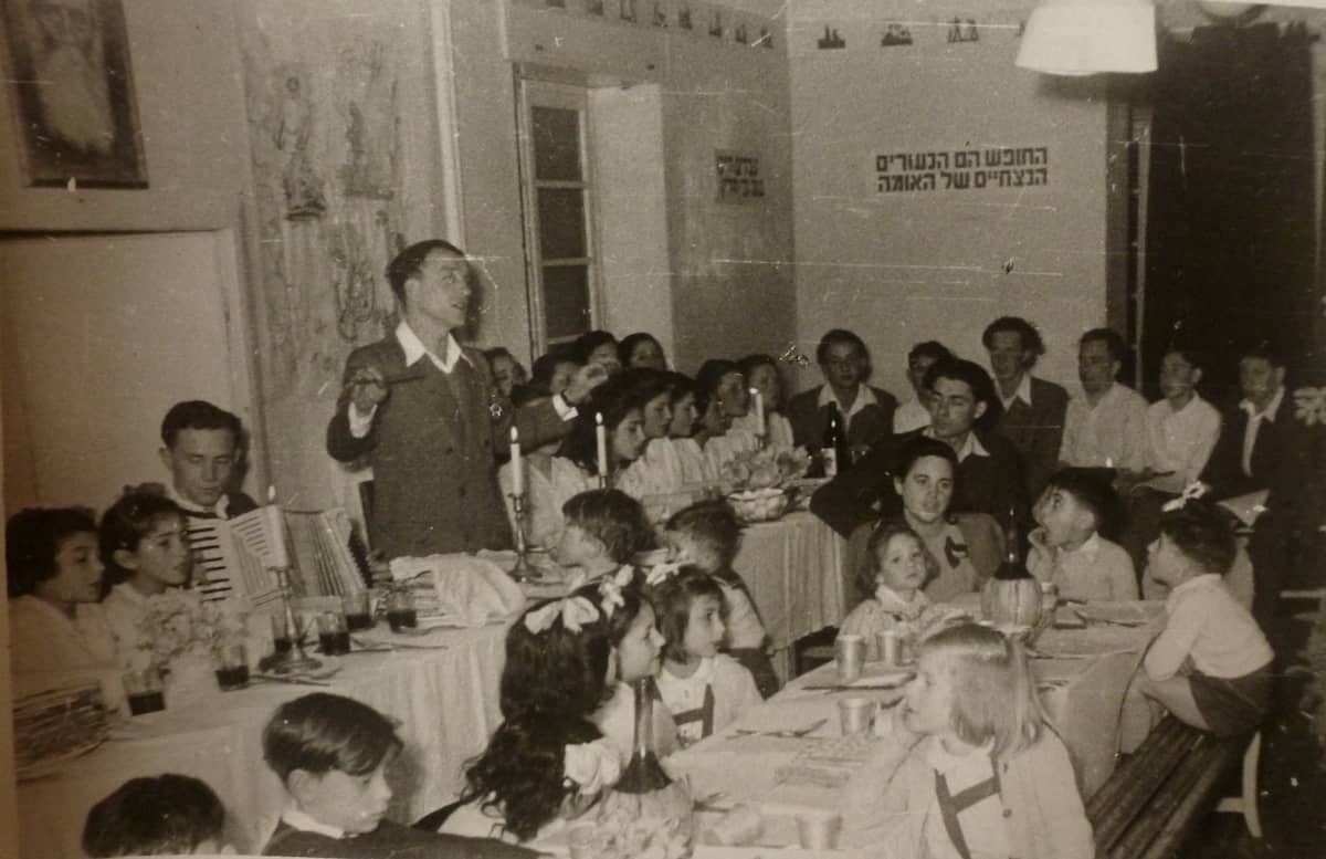 Vintage photo of Passover Eve at the Sciesopoli House (credit: Wikipedia Commons)