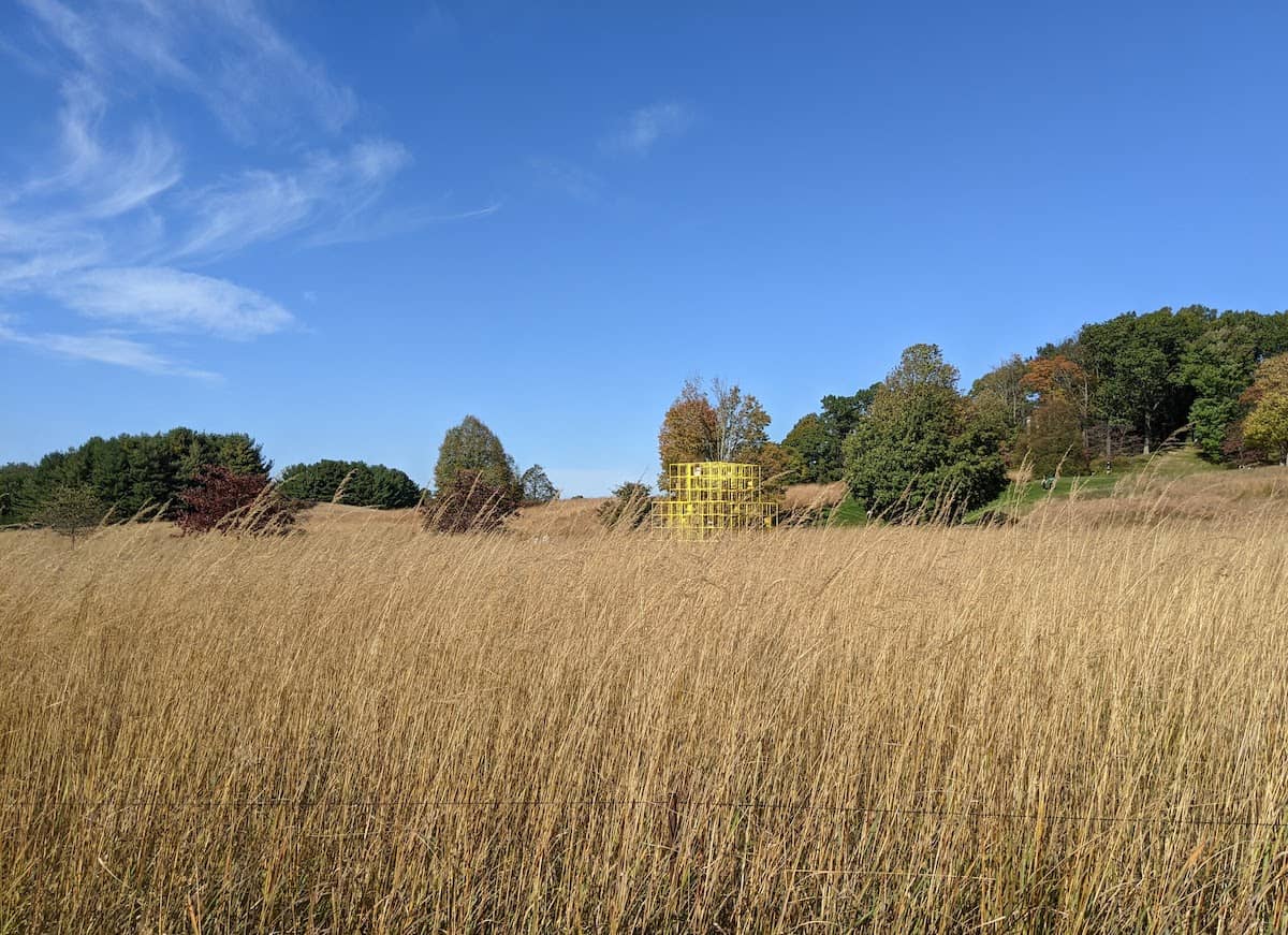 The Crisis by Rashid Johnson - A 16-foot-tall, yellow pyramidal steel structure set in a field of native grasses that took 25 years to cultivate (credit: Andrew Levine)