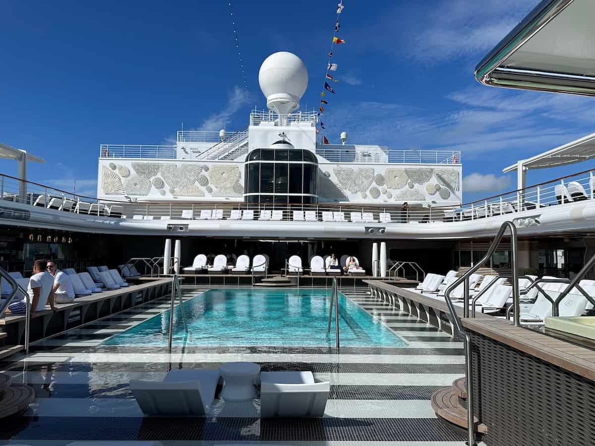 Pool deck on Regent Seven Seas Grandeur; featuring a lavish pool and two whirlpools