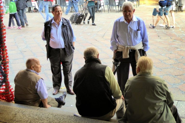 Umarells in Piazza Maggiore in Bologna