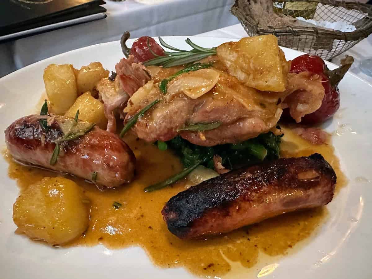 Pollo alla Samantha (Scarpariello) at Lanni's Cucina Verace: Crispy Boneless Organic Chicken Leg and Thigh with Sweet Sausages, Hot and Sweet Cherry Peppers, Garlic, and Rosemary, served with Broccoli Rabe