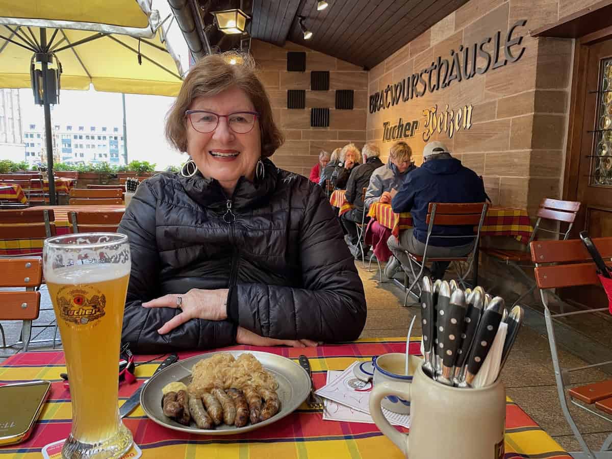 Enjoying traditional bratwurst and sauerkraut in Nuremberg