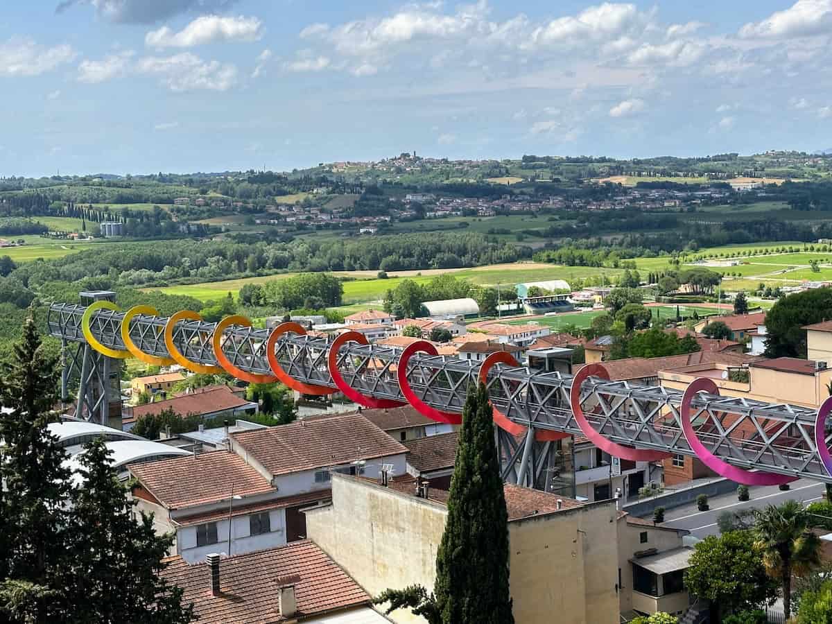 Endless Sunset is a panoramic walkway by Patrick Tuttofuoco that links the center of the small medieval village to the new areas of the town.