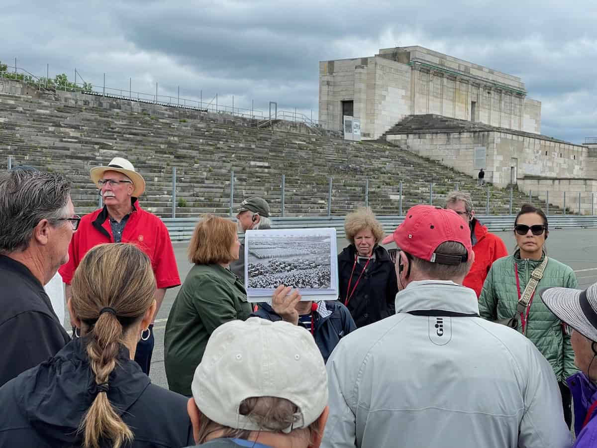 Viking guide in Nuremberg shows photos of Nazi rallies at this stadium