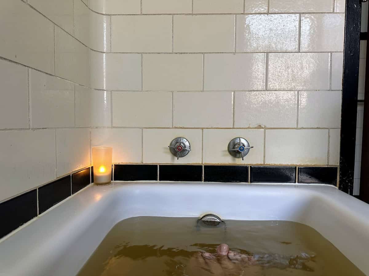 A peek inside my tub at the Roosevelt Baths; notice muddy color of buoyant mineral waters