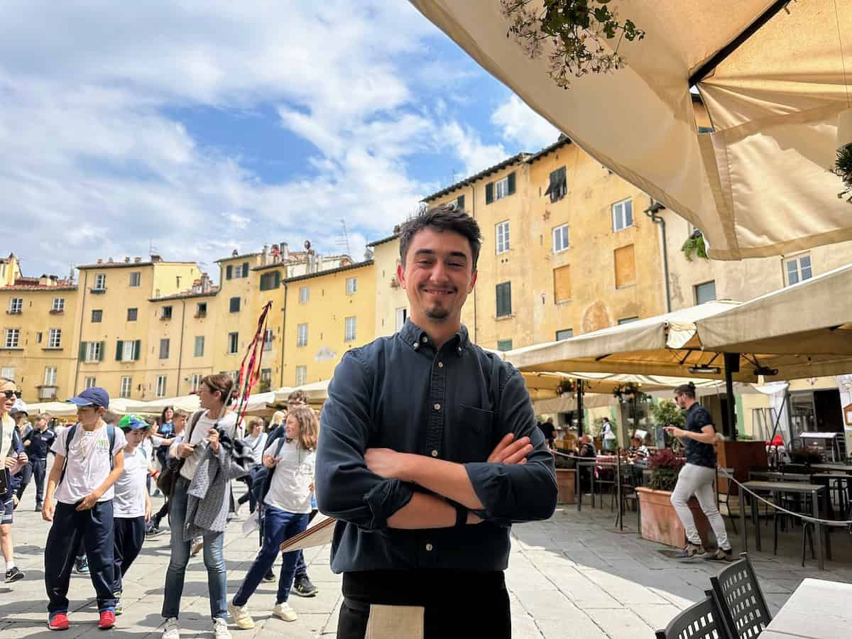 Eugenio of Sotto Sotto with a group of tourists passing through the piazza (credit: Irene S. Levine)