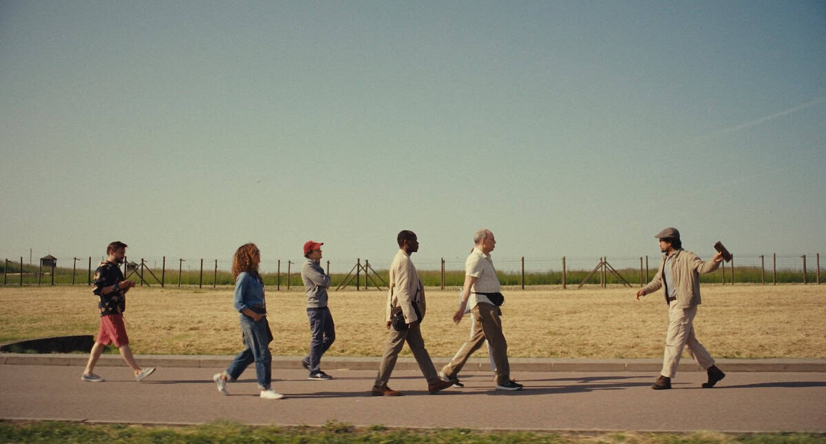 The tour group led by their English guide, portrayed by Will Sharpe (credit: Searchlight Pictures)