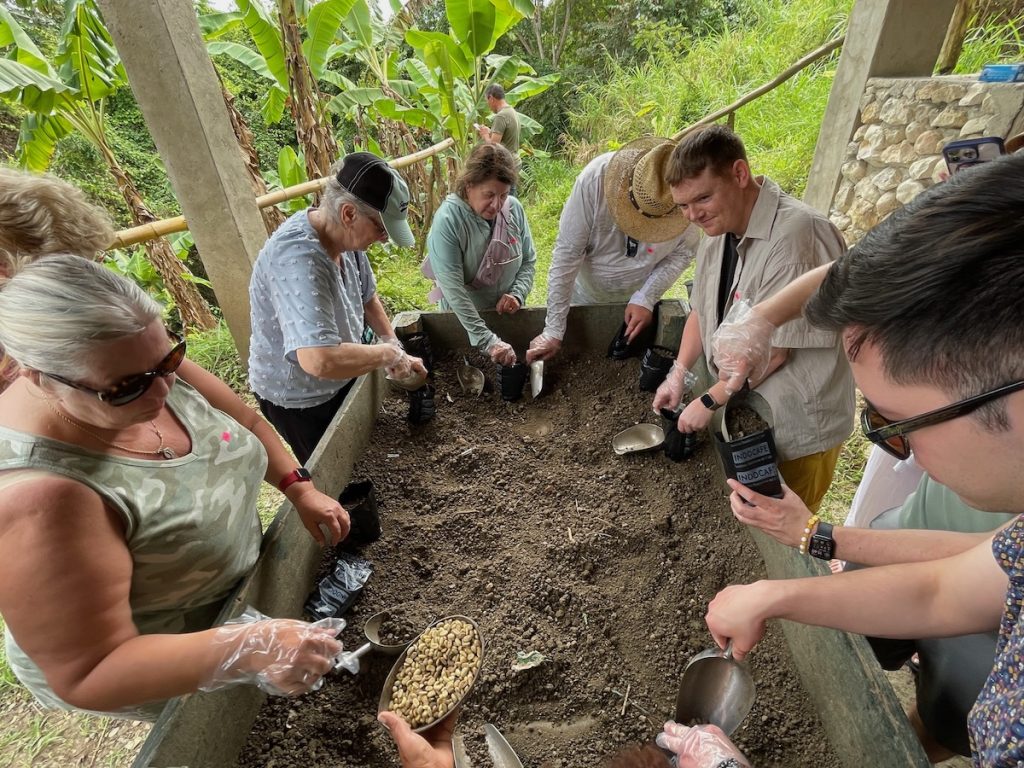 Guests use soil, pots, and seeds on the Dominican Coffee Tour (credit: John and Sandra Nowlan)