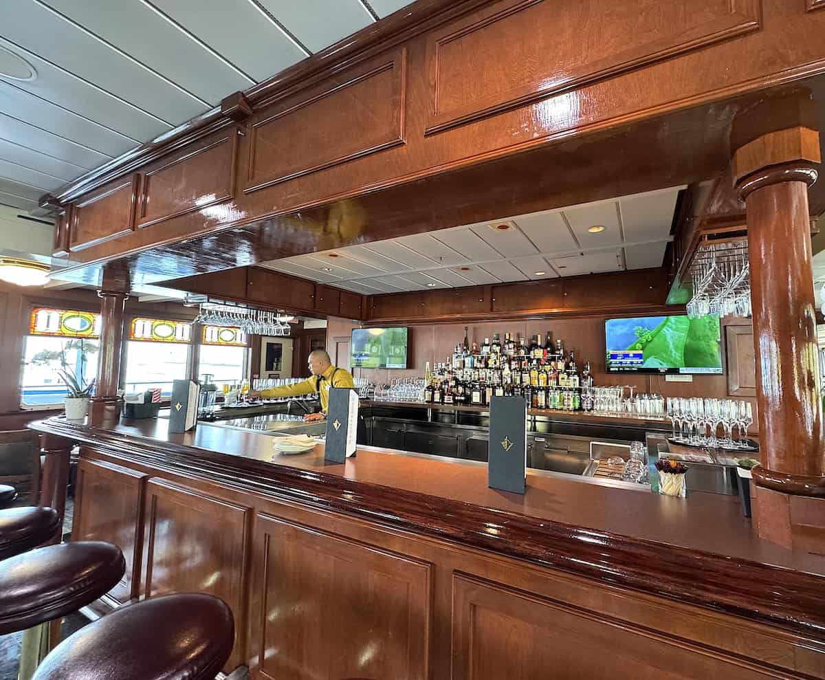 With stained-glass windows and polished wood, the Tavern on Victory II seems like an old English pub (credit: Jackie Sheckler Finch)