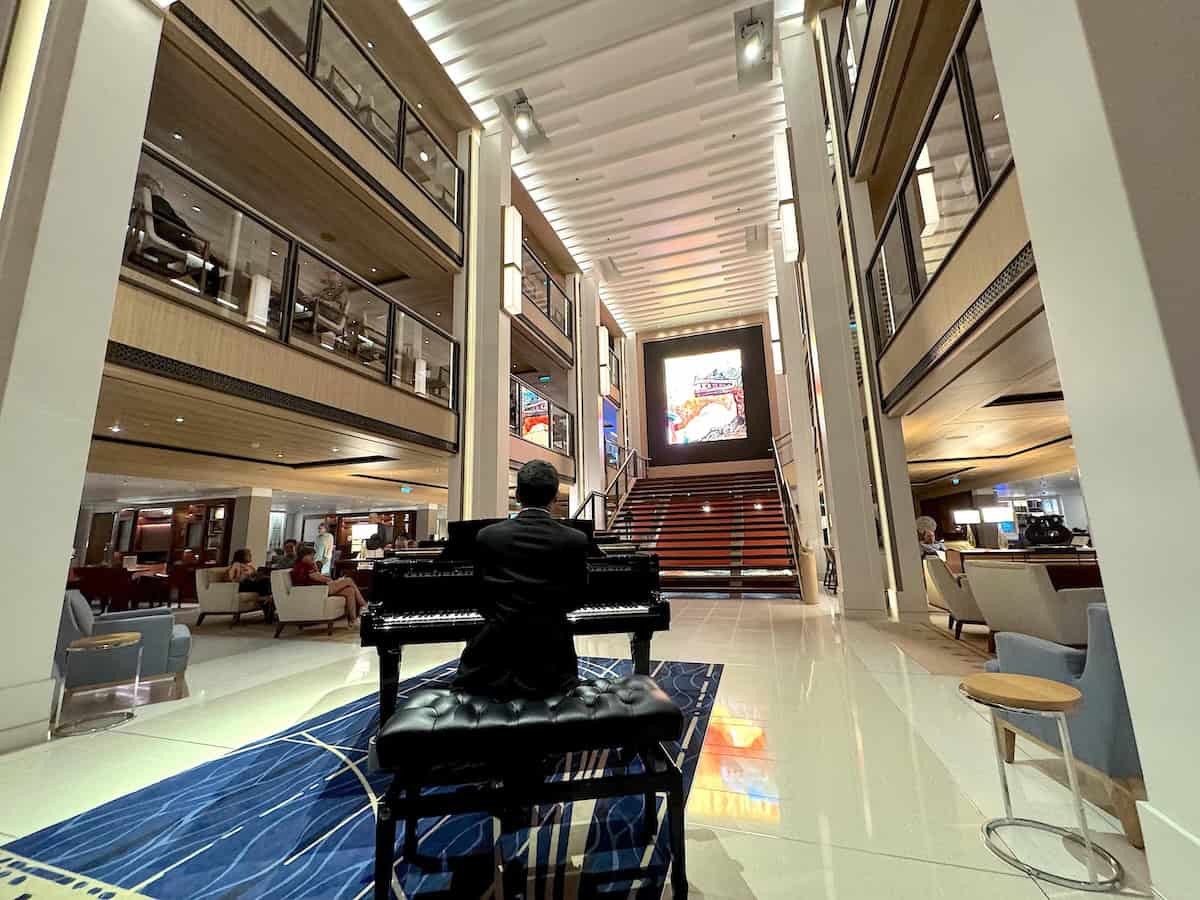 Pianist Artur performs in the ship’s main gathering spot, the Atrium ((credit: Jackie Sheckler Finch)