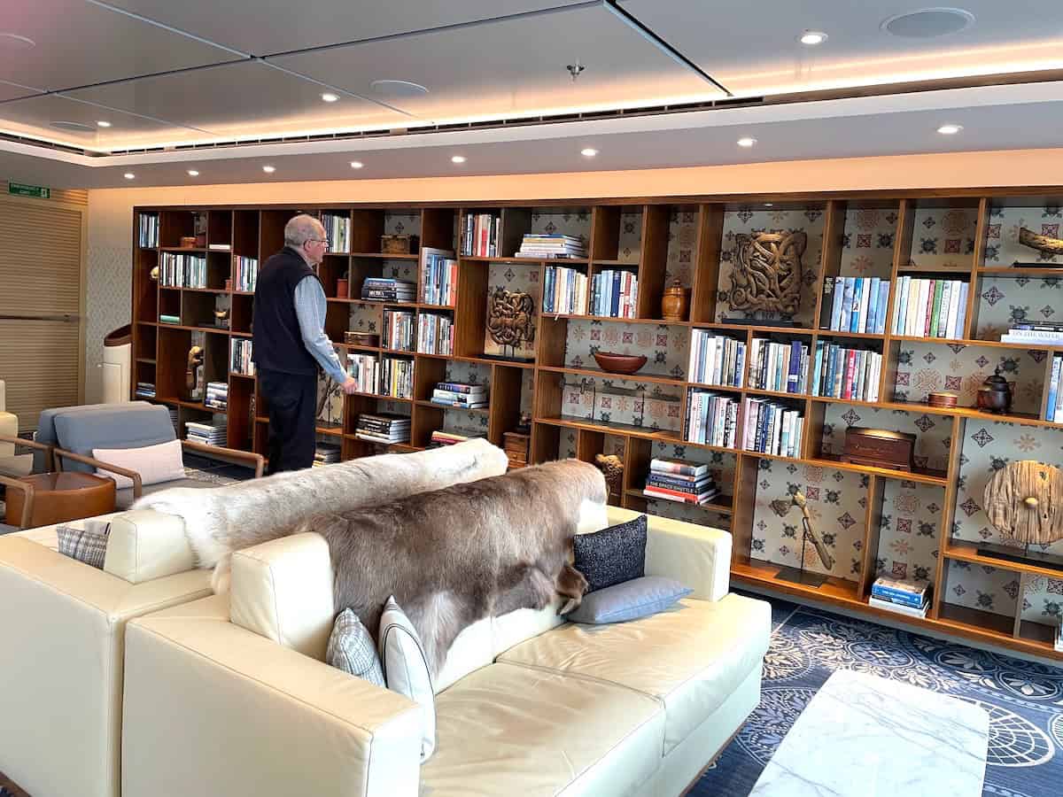 Library in the Explorer&rsquo;s Lounge with reindeer hides on sofas (credit: John and Sandra Nowlan)