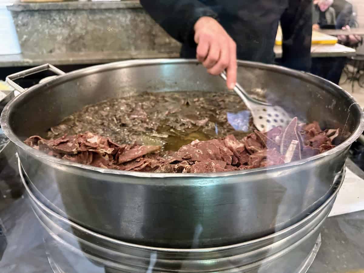 Stirring the pot at Antica Focacceria San Francesco (credit: Jerome Levine)
