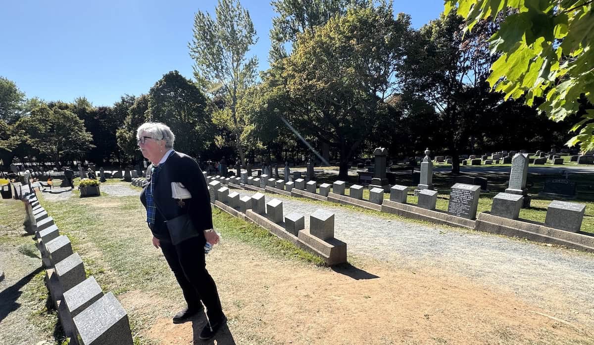 Guide Helen explains that stones in the Titanic cemetery are laid out to resemble a ship's hull (credit: Jackie Sheckler Finch)