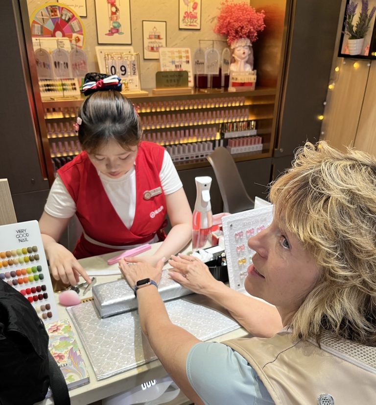 Author receiving her manicure (credit: Chris and Joe Scott)