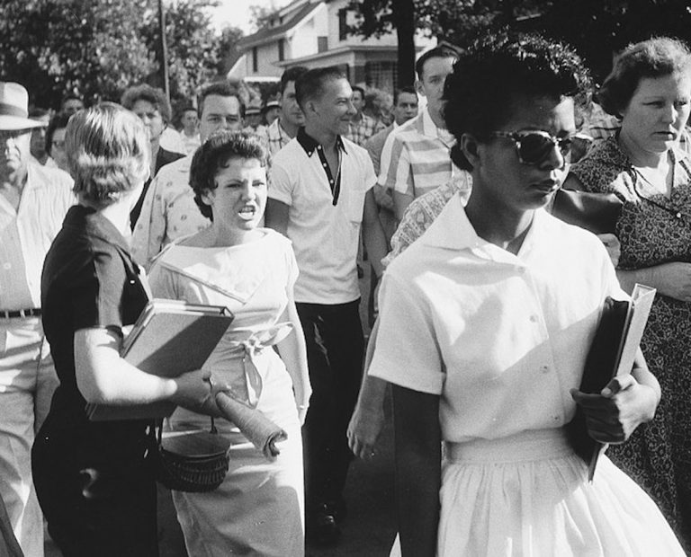 Elizabeth Eckford walks alone through an angry crowd, including student Hazel Bryan, in this photo taken by Will Counts (credit: Little Rock Central High School National Historic Site)