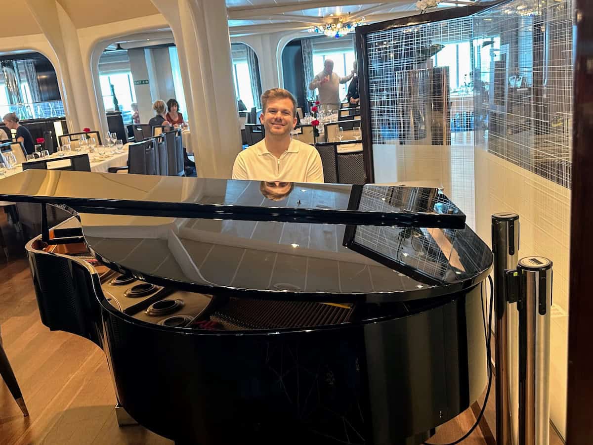 Piano man on the grand piano at The Restaurant, the Seabourn Encore main dining room (credit: Irene S. Levine).