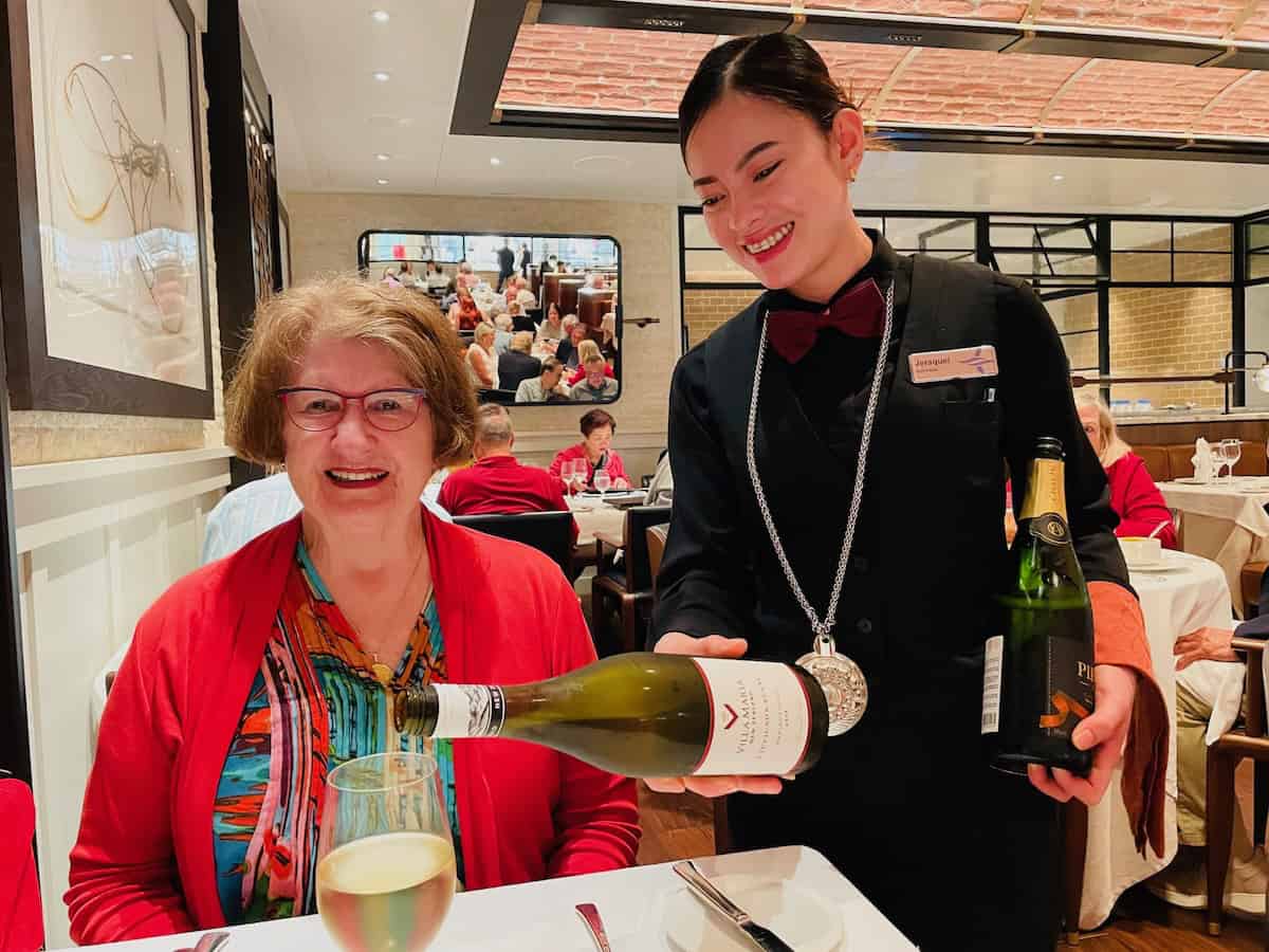 andra enjoying a glass of wine at dinner (credit: John Nowlan)