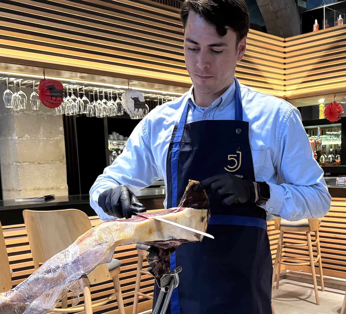 Samuel carving Jamón Ibérico at Toro Tapas (credit: Jackie Sheckler Finch)