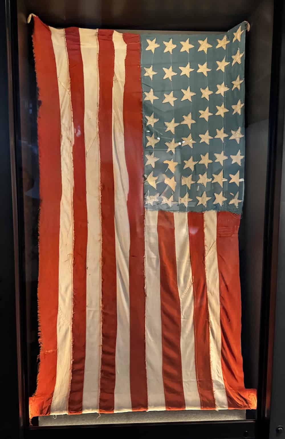 Three American POWs were ordered to burn the American flag. Instead, they removed the 48 stars and kept them hidden for three years until they could remake a flag to fly over the camp when Americans arrived (credit: Jackie Sheckler Finch)
