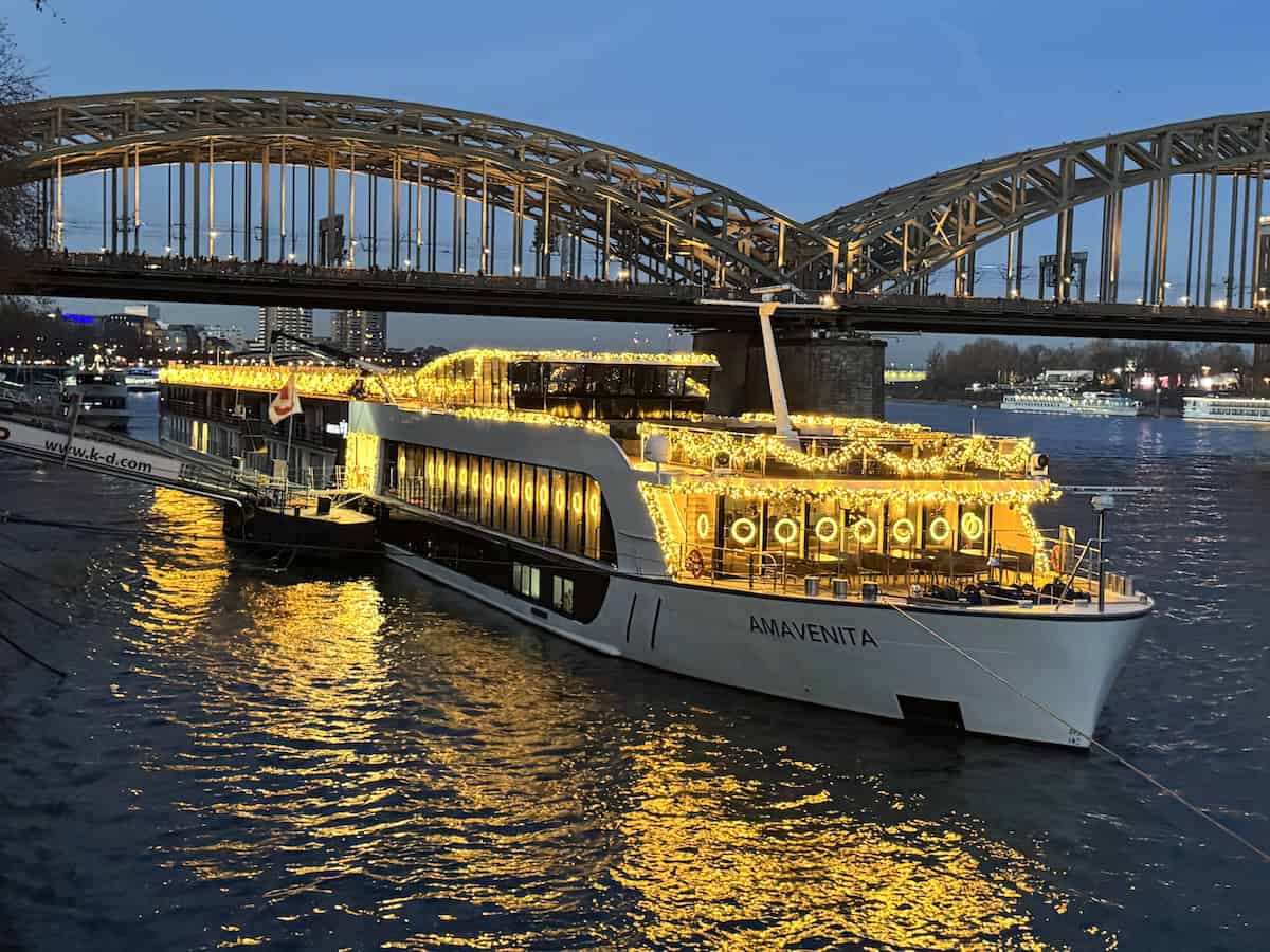 The AmaVenita is lit up dockside in Cologne (credit: James Ross)