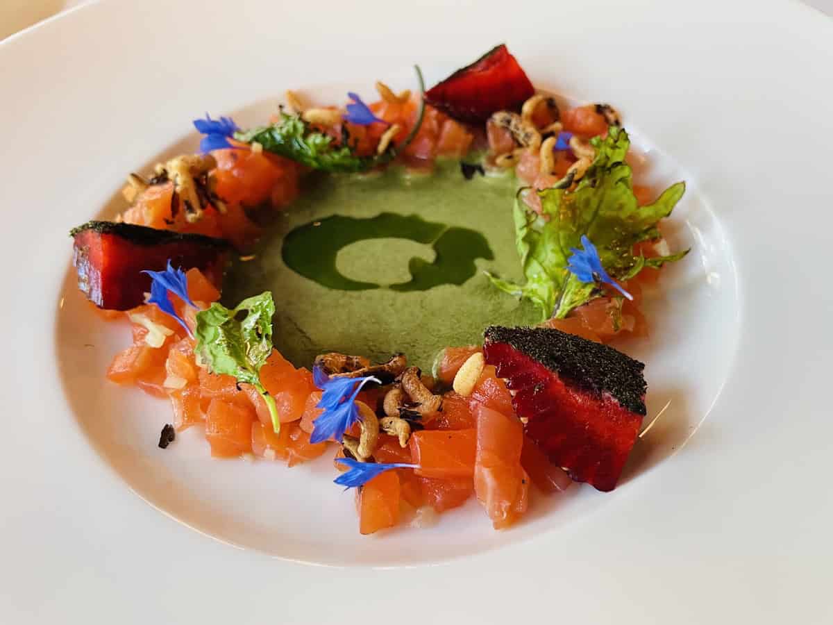 Chef Normand Laprise’s kitchen. Trout gravlax with kale, strawberry, and green garlic oil (credit: John & Sandra Nowlan)