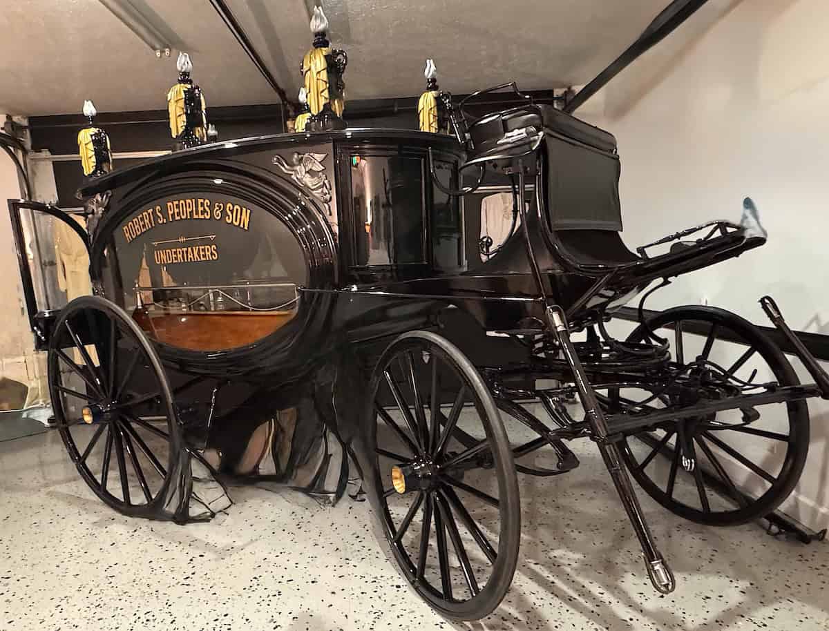 An 1870 George L. Brownell Hearse built in New Bedford, Mass. Bill Peoples had his father’s name painted on the glass windows to honor his long career in the funeral profession. Robert S. Peoples died in 1988 (credit: Jackie Sheckler Finch)